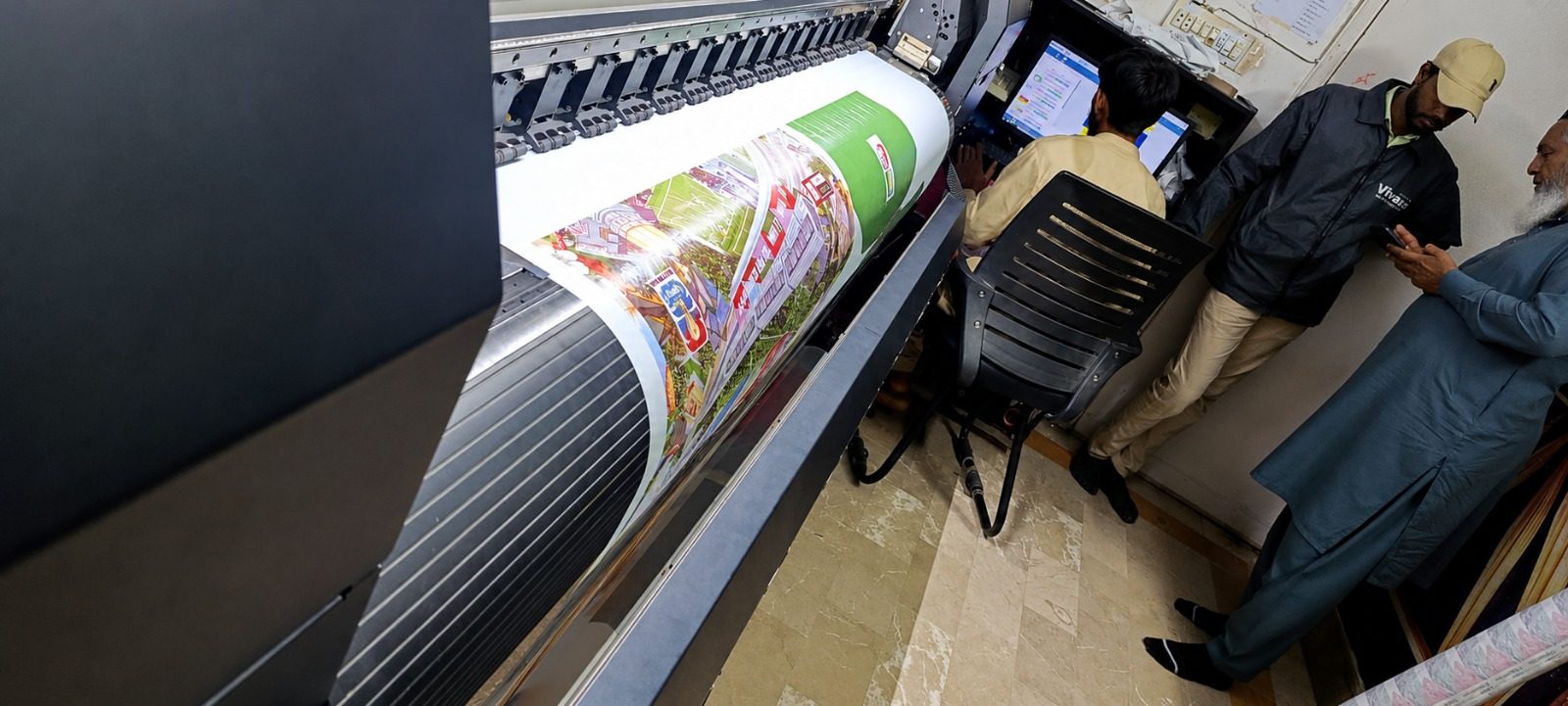 Printed fabric coming out of the industrial printer